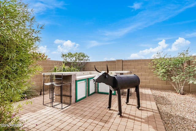 view of patio with exterior bar