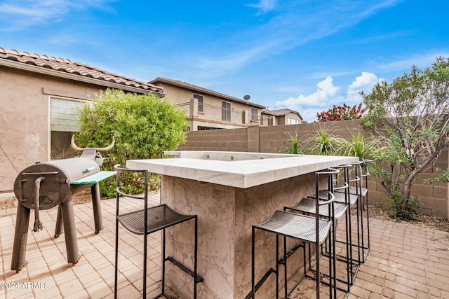 view of patio with a bar