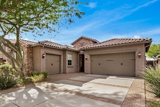 mediterranean / spanish house featuring a garage