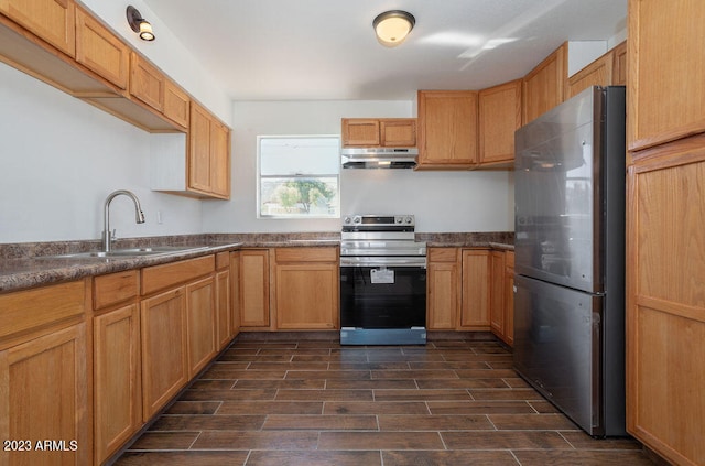 kitchen with sink, electric stove, and stainless steel refrigerator