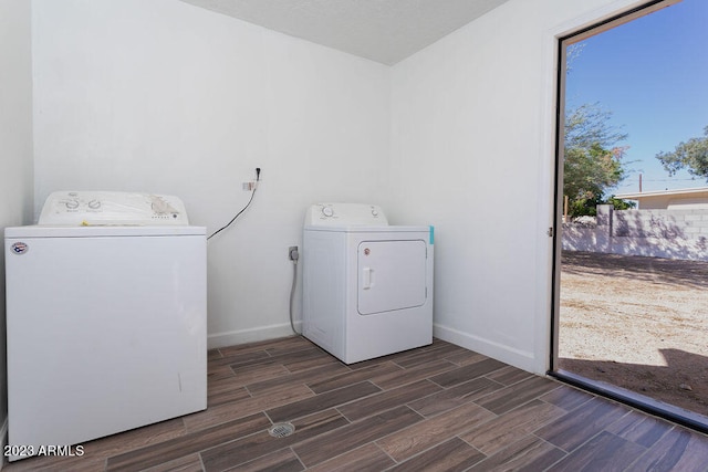 clothes washing area with electric dryer hookup and washer and clothes dryer