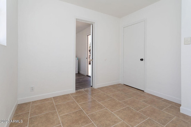 empty room with light hardwood / wood-style flooring