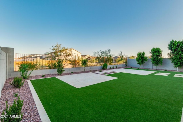 view of yard with a patio area and a fenced backyard