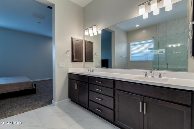 full bath featuring visible vents, marble finish floor, a sink, baseboards, and tiled shower