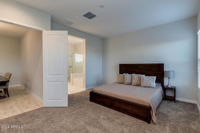 bedroom with visible vents, carpet flooring, and baseboards