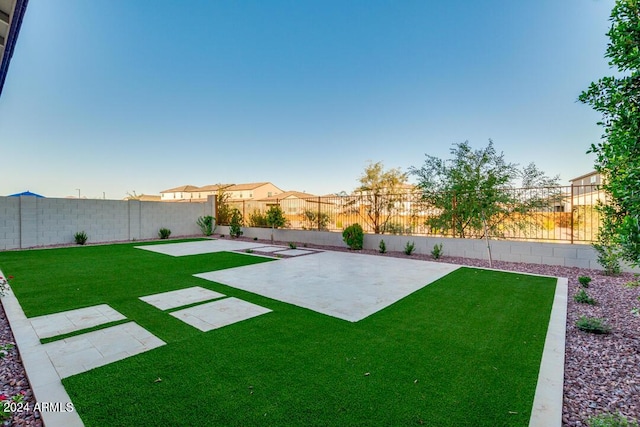 view of yard with a fenced backyard and a patio area