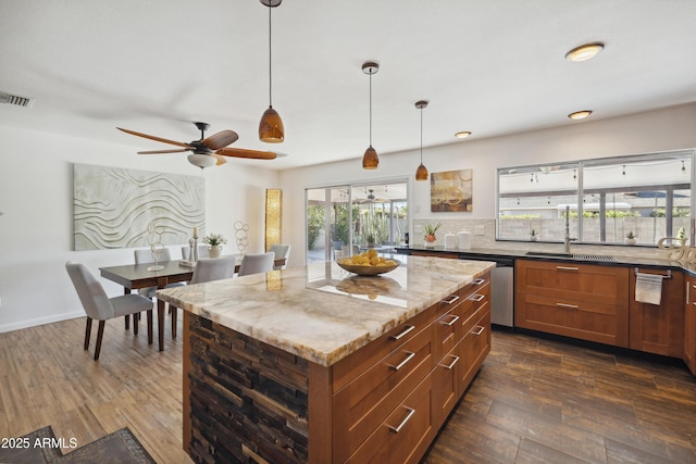 5802 E Spring Rd, Scottsdale, AZ 85254 - kitchen featuring dishwasher, dark wood-style flooring, light stone countertops, ceiling fan, and a sink