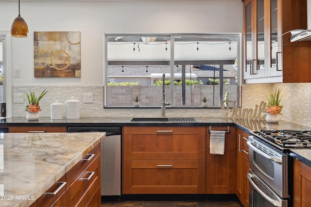 5802 E Spring Rd, Scottsdale, AZ 85254 - kitchen featuring stainless steel appliances, light stone counters, healthy amount of natural light, and a sink