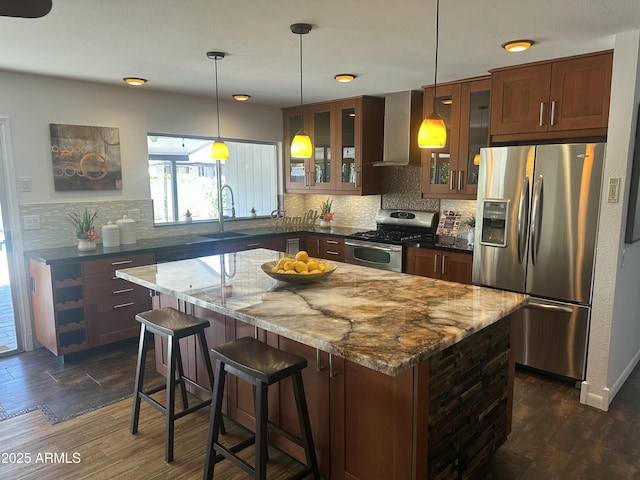 5802 E Spring Rd, Scottsdale, AZ 85254 - kitchen with stainless steel appliances, wall chimney range hood, glass insert cabinets, and dark wood-style floors