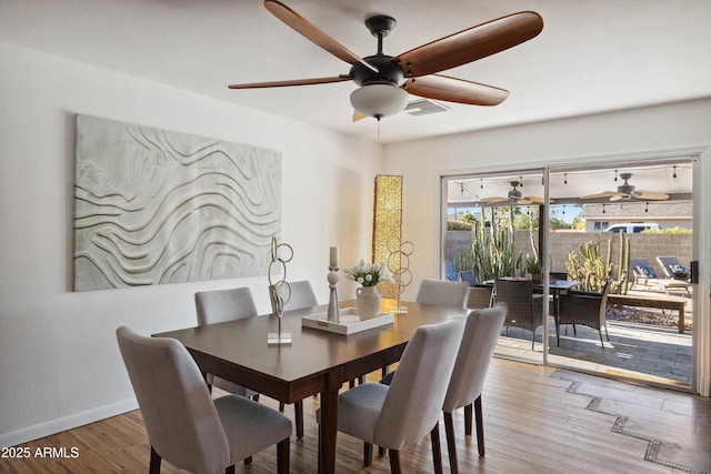 5802 E Spring Rd, Scottsdale, AZ 85254 - dining room featuring ceiling fan, baseboards, and wood finished floors