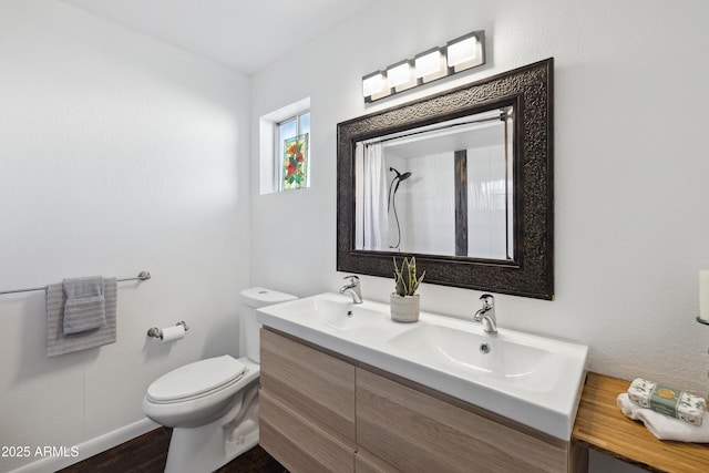 5802 E Spring Rd, Scottsdale, AZ 85254 - full bath featuring toilet, a shower, baseboards, double vanity, and wood finished floors
