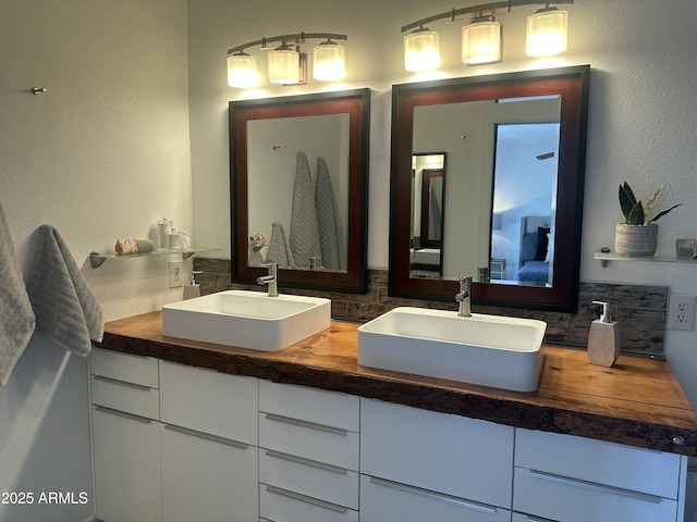 5802 E Spring Rd, Scottsdale, AZ 85254 - ensuite bathroom featuring double vanity and tasteful backsplash