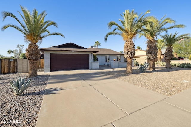 5802 E Spring Rd, Scottsdale, AZ 85254 - ranch-style house featuring concrete driveway, an attached garage, and fence