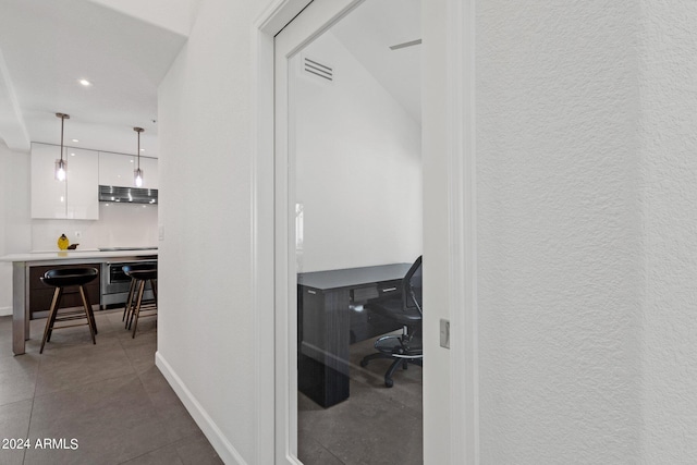 hallway with tile floors