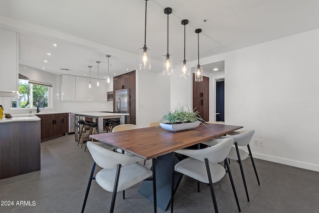 dining room with dark tile flooring