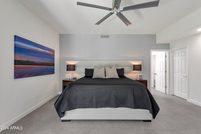 tiled bedroom with ceiling fan