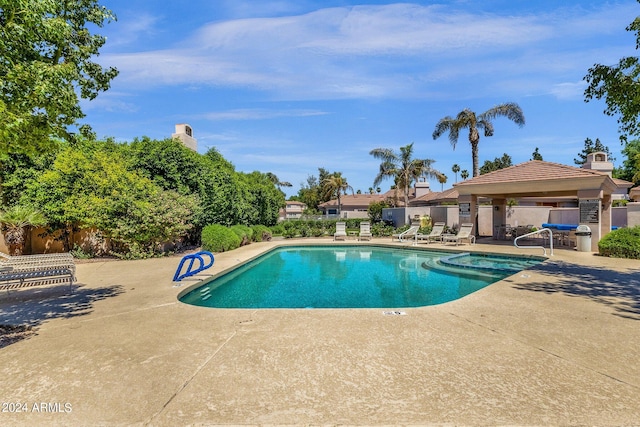 view of pool with a patio area and a gazebo