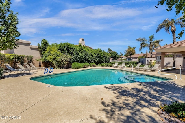 view of swimming pool featuring a patio area