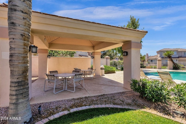 view of patio featuring a gazebo and a fenced in pool