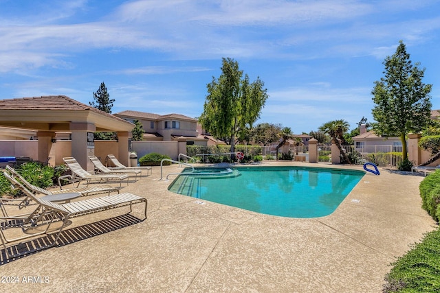 view of swimming pool featuring a patio area