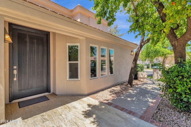 doorway to property with a patio area