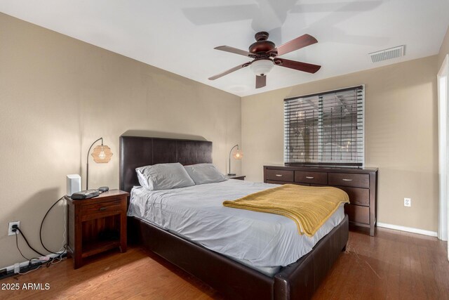 3643 E Friess Dr, Phoenix, AZ 85032 - bedroom with wood finished floors, baseboards, and ceiling fan