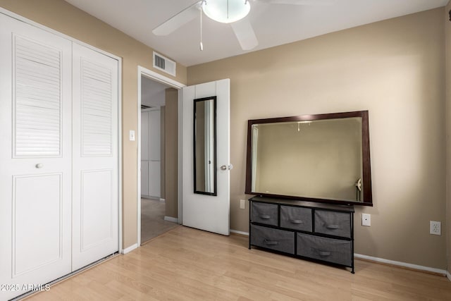 3643 E Friess Dr, Phoenix, AZ 85032 - unfurnished bedroom featuring wood finished floors, baseboards, ceiling fan, and a closet
