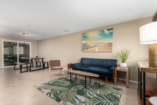 3643 E Friess Dr, Phoenix, AZ 85032 - living room featuring baseboards and light tile patterned flooring