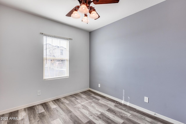 unfurnished room featuring hardwood / wood-style flooring and ceiling fan