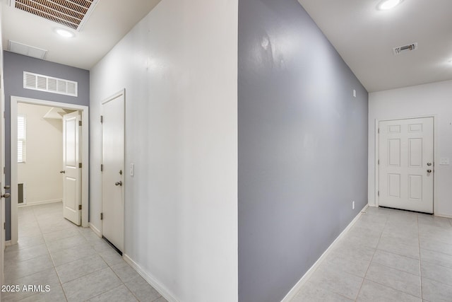 hallway featuring light tile patterned floors