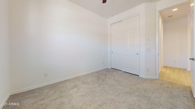 unfurnished bedroom with a closet, baseboards, ceiling fan, recessed lighting, and carpet flooring