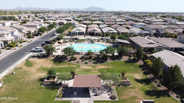 drone / aerial view featuring a mountain view and a residential view