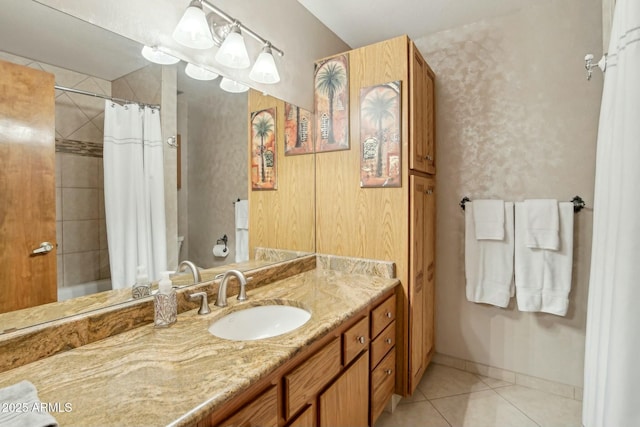 bathroom featuring tile patterned flooring, vanity, and shower / bath combo with shower curtain