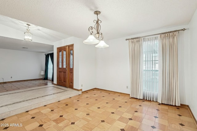 empty room with a textured ceiling