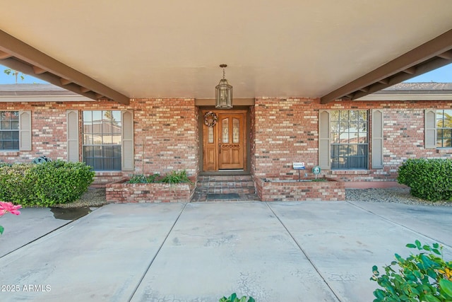 entrance to property featuring a patio