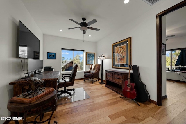 office space featuring light wood-style flooring, recessed lighting, a ceiling fan, baseboards, and visible vents