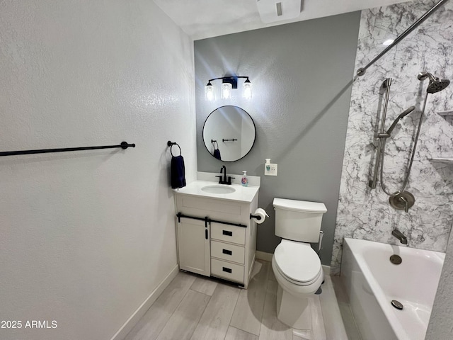 full bathroom with vanity, toilet, and  shower combination