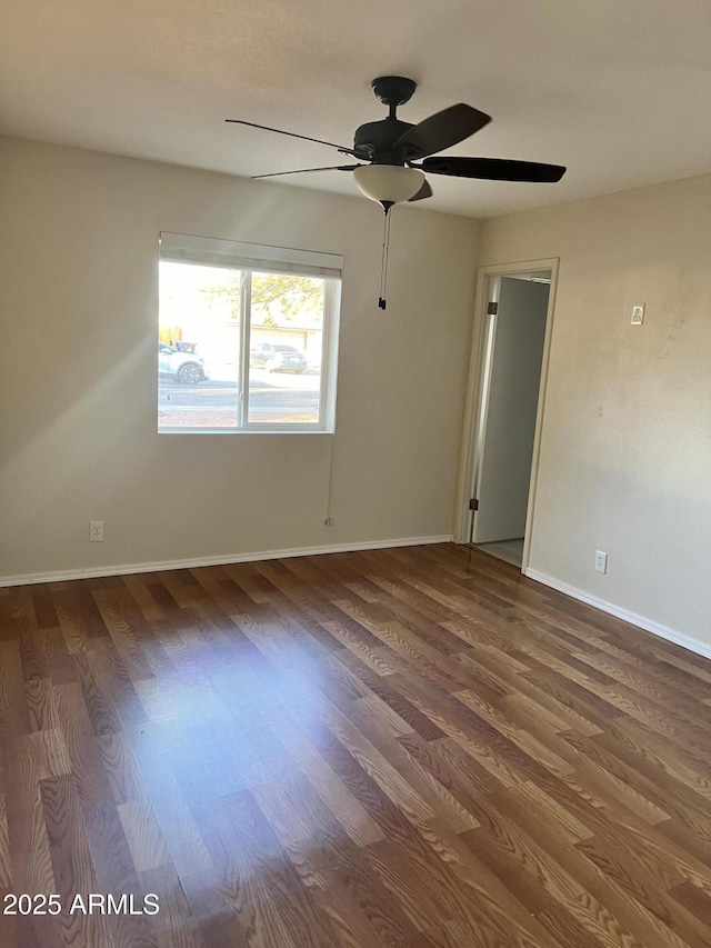 unfurnished room with hardwood / wood-style flooring and ceiling fan