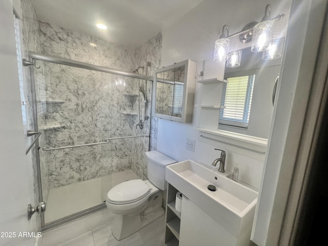 bathroom featuring vanity, toilet, and walk in shower