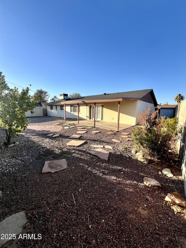 rear view of house featuring a patio