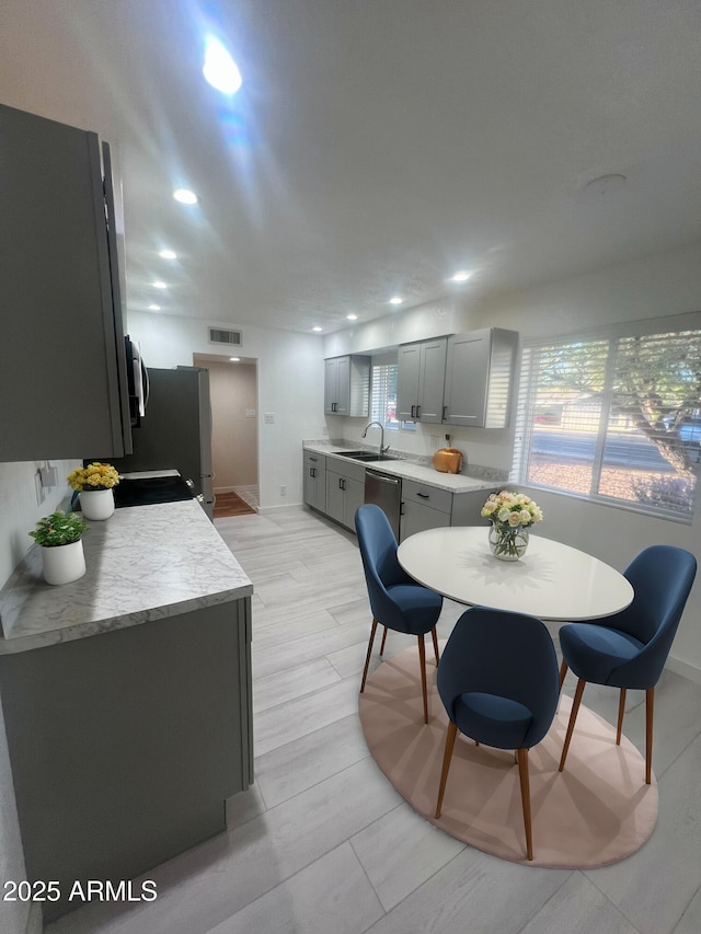 dining room featuring sink