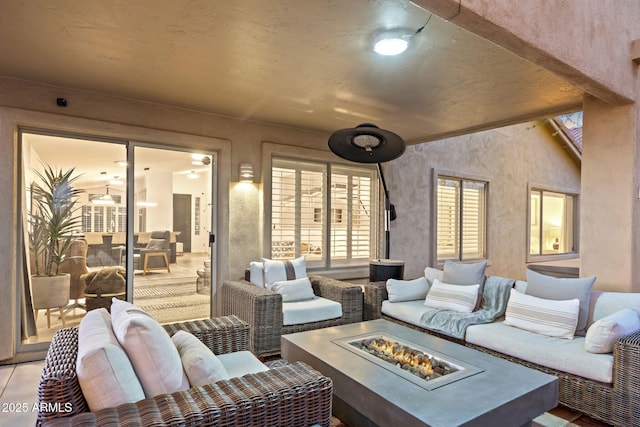 interior space with an outdoor living space with a fire pit