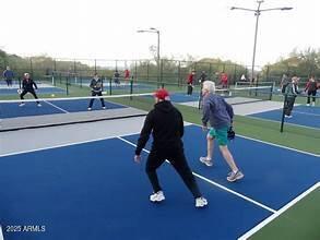 view of sport court with fence