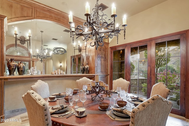 dining room with an inviting chandelier and light tile floors