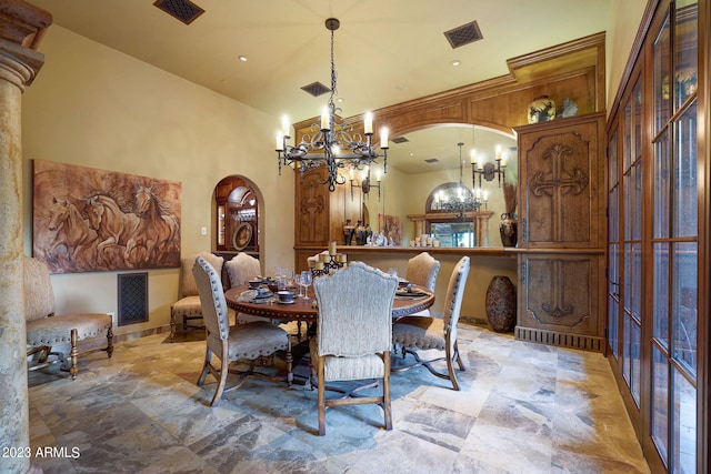 tiled dining area featuring a notable chandelier