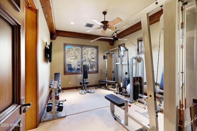 workout room featuring ceiling fan and light carpet