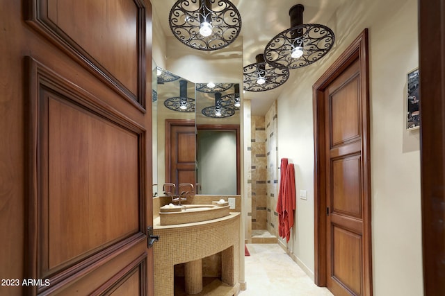 bathroom with tile floors and sink