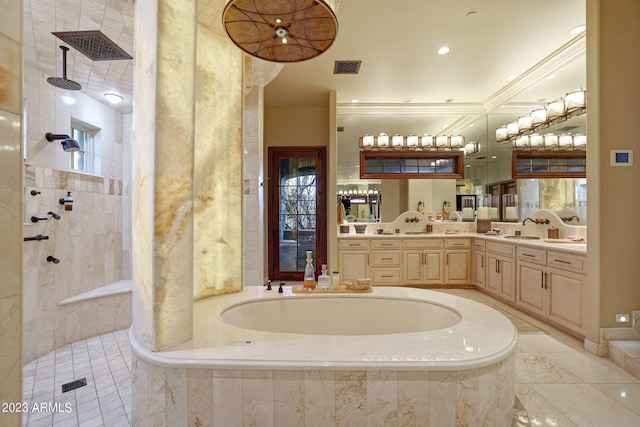 bathroom featuring tile floors, plenty of natural light, vanity, and a relaxing tiled bath