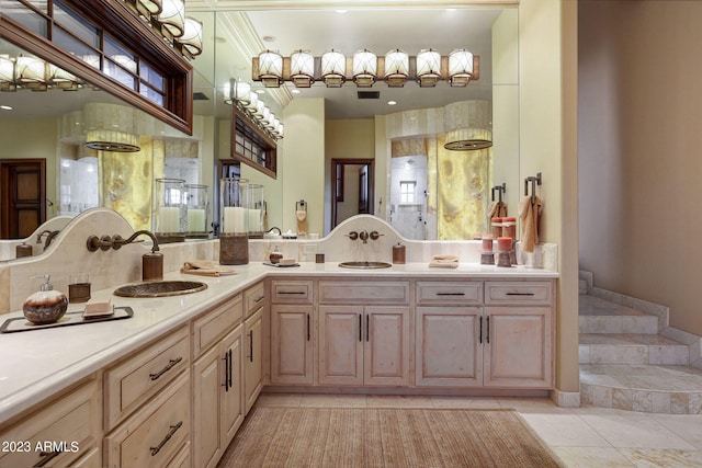 bathroom with dual vanity, tile floors, and ornamental molding