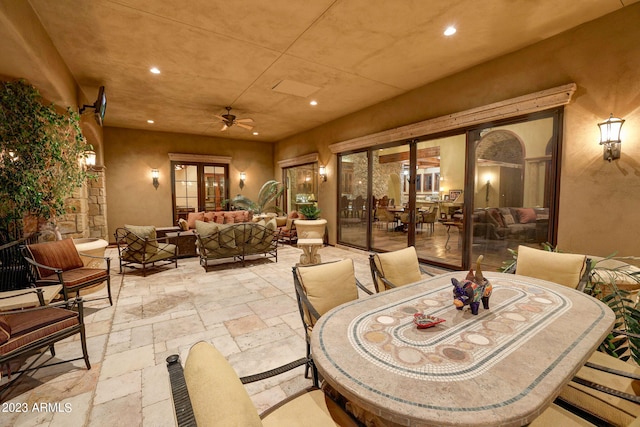 view of terrace featuring an outdoor hangout area and ceiling fan